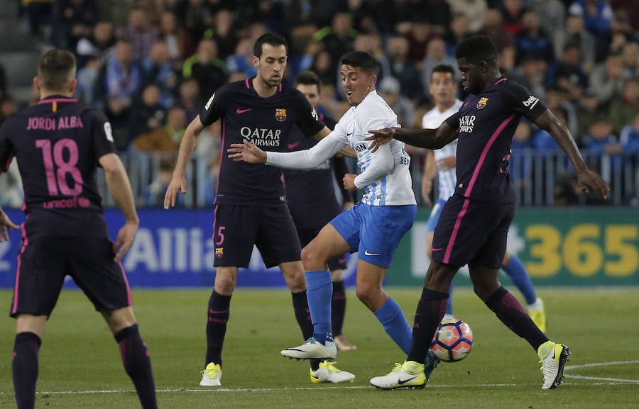 El partido del Málaga-Barcelona, en imágenes