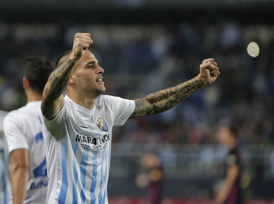 El partido del Málaga-Barcelona, en imágenes