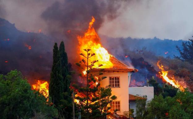 A house burns./REUTERS