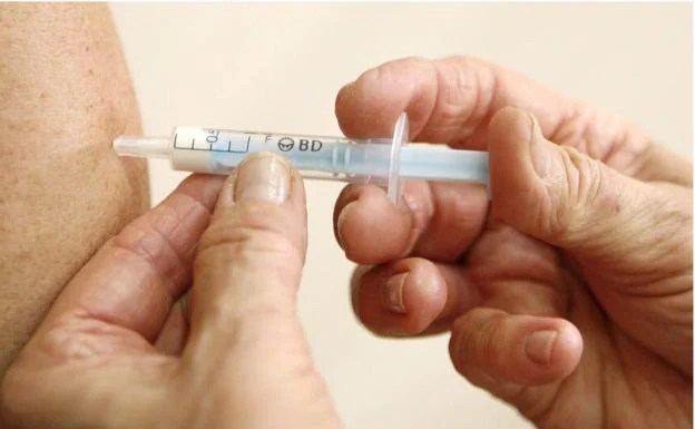A flu vaccination is given. File photograph.