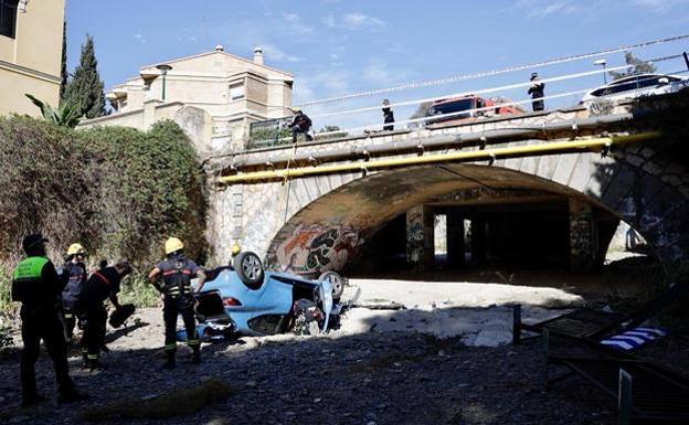 Woman injured after car plunges from road bridge into stream