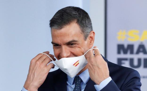 When will masks be mandatory outdoors in Spain and what are the exceptions?