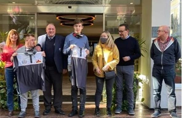 Disabled golfers receive their shirts for May's Pro-Am
