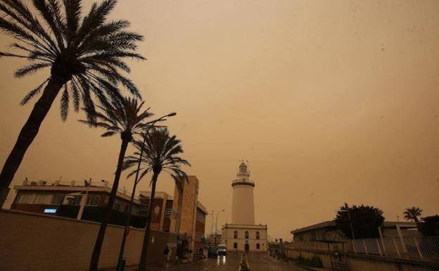 The Sahara sand calima, which has turned everything orange, will stick around today but start to move east later