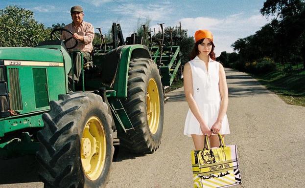 Tractor driver with the Christian Dior model. 