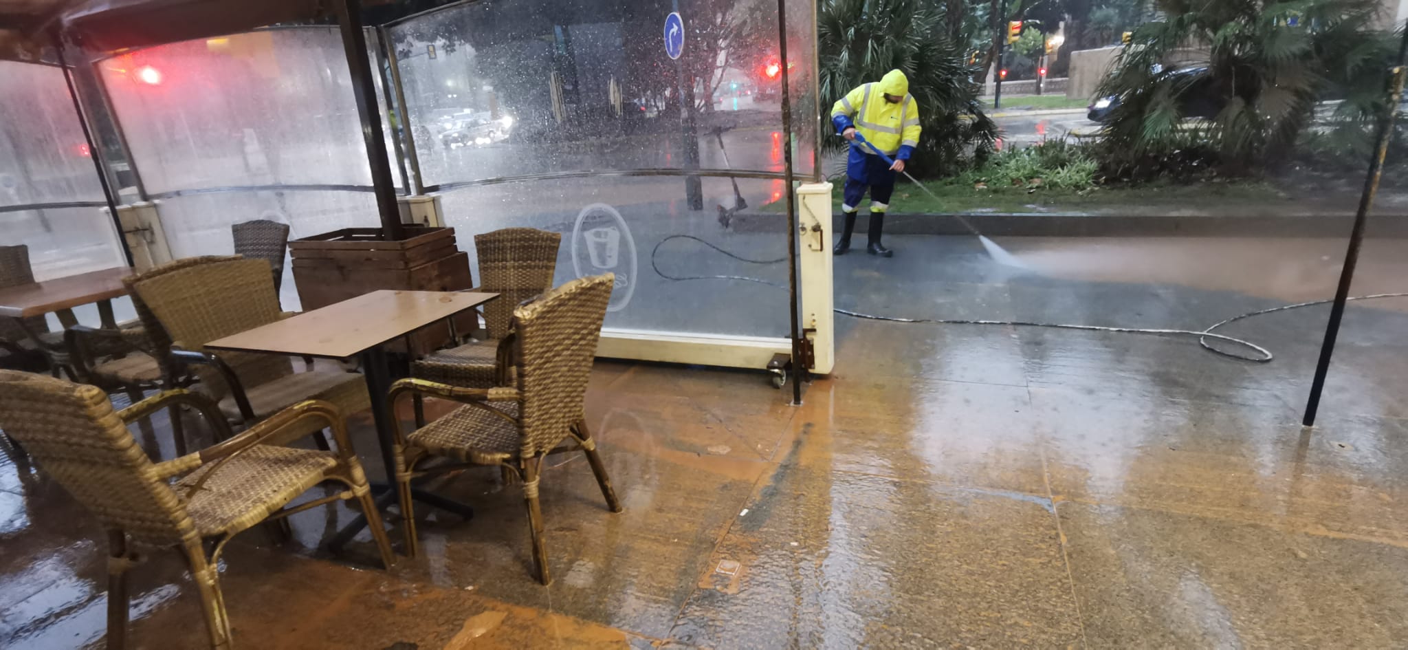 Malaga wakes to cars, buildings and streets covered in red mud