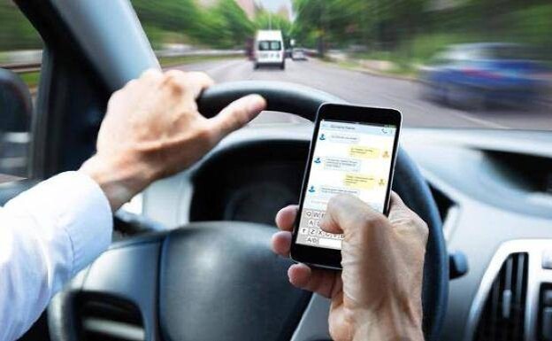 Using a mobile phone while driving is risky in more ways than one. /sur