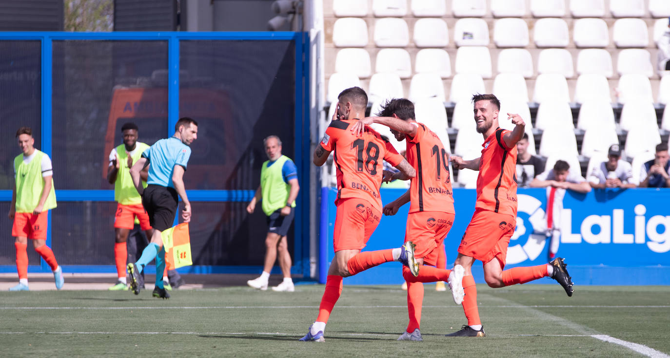 Malaga players celebrate scoring the opening goal of the game against Leganés. 