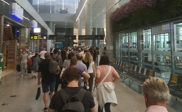 File photograph of the border control queue at Malaga Airport for travellers going to non-EU countries.