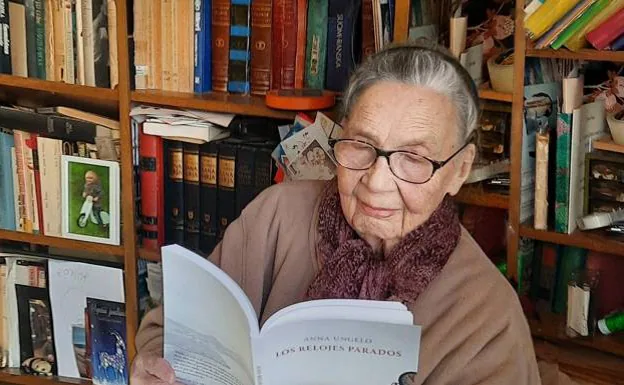 The Finnish writer Anna Ungelo with a copy of the Spanish version of her book, at her home in Paris 