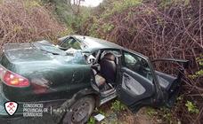 Driver rescued after car plunges 30-metres down an embankment
