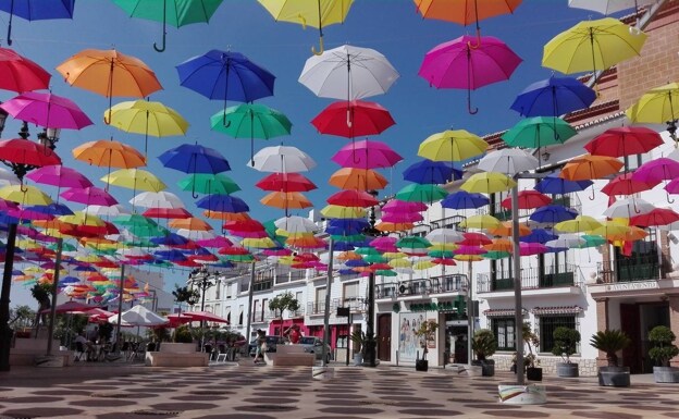 Plaza de la Constitución in Torrox pueblo with its iconic umbrellas 