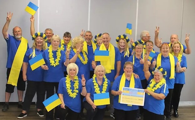The TAPAS choir dressed in support of Ukraine Aid. /TAPAS
