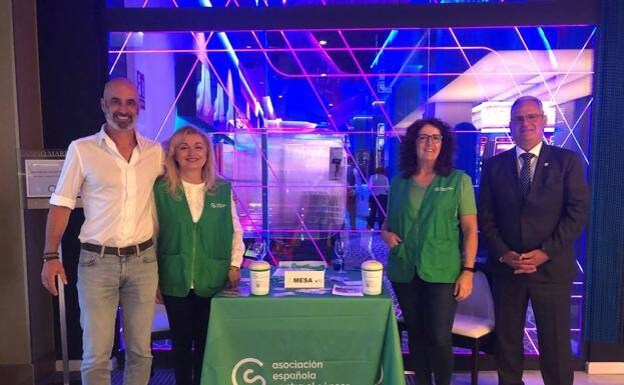 Volunteers at the association's table in the reception area of Marbella's casino 