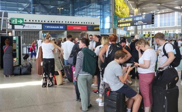 Passengers at the Ryanair desk at Malaga airport last weekend, after their flights were cancelled.