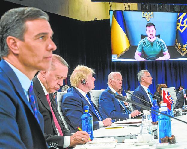 Leaders listen to Ukraine's president speaking during the summit. 
