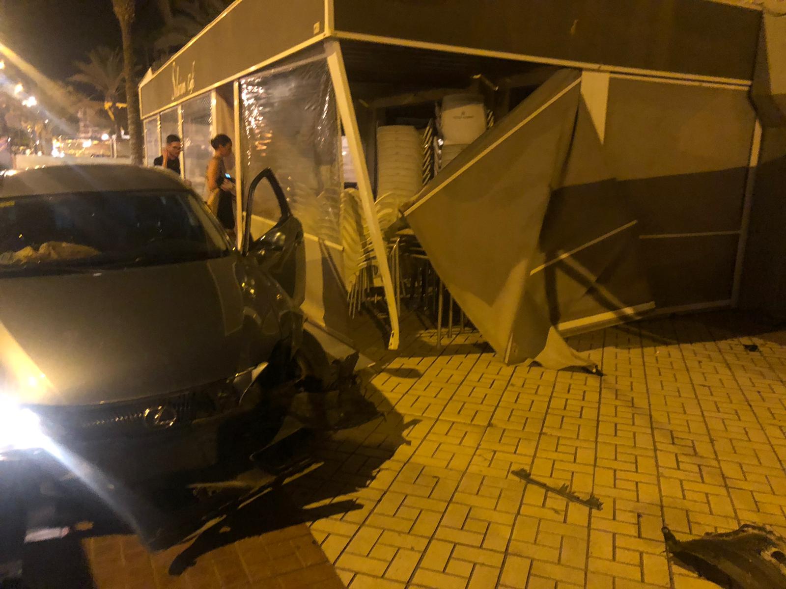 Two injured after over drink-drive limit British man ploughs his 'speeding' car into seafront café in Torre del Mar