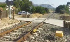 Young woman dies after car is hit by train on level crossing in Álora
