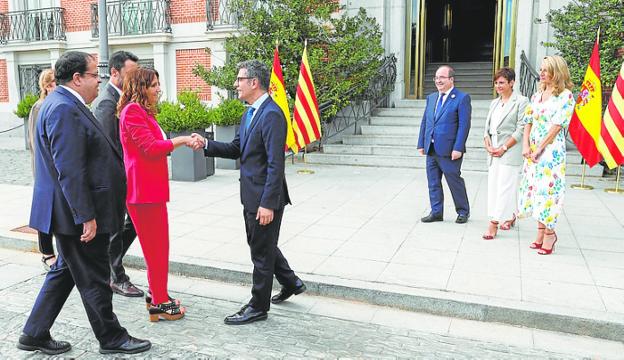Spanish government ministers greet Catalan ministers on Wednesday. 