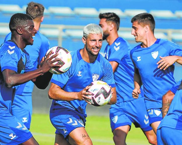 Some of Malaga's summer signings during training last week. / M. POZO