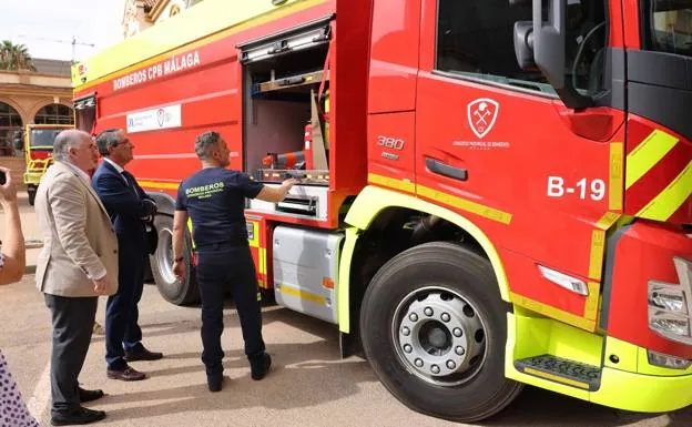 Francisco Salado and Manuel Marmolejo, the Consortium president, being shown a new fire engine. 