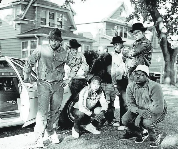 Run DMC and Posse Hollis pose for Beckman in Queens in 1984. 