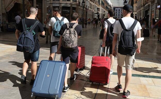 Young tourists arriving in Malaga. 