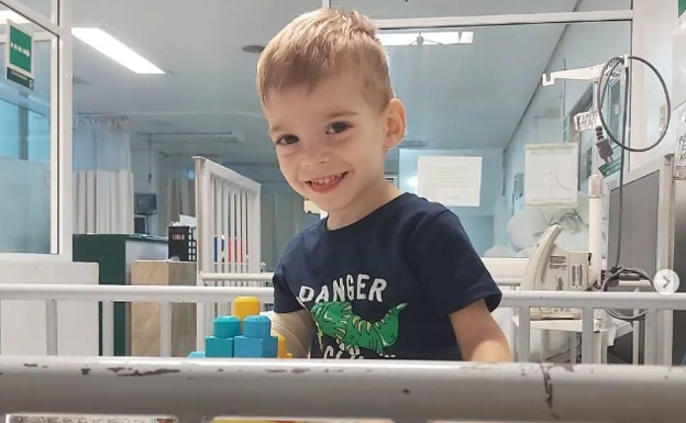 Two-year-old Oliver lands back in Spain and awaits test results for urgent brain tumour operation