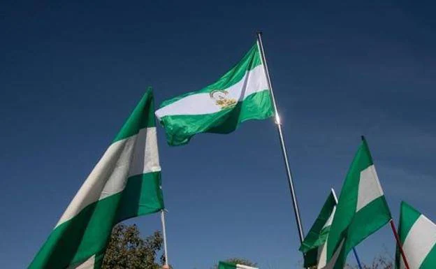 The green and white flag of Andalucía. 