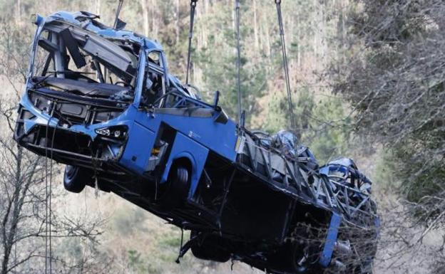 Death toll rises to seven after bus plunges 30 metres from bridge into flooded river in Spain