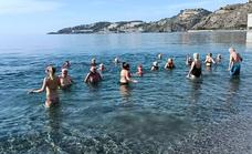 Almost one hundred bathers brave the sea for first New Year’s Day swim in three years