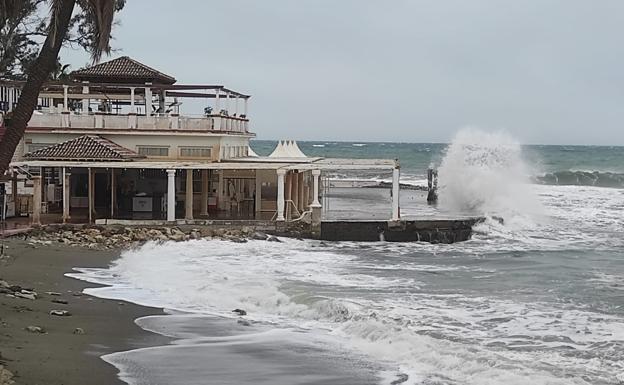 Clean up begins after four-metre-high waves and gale-force winds batter Costa del Sol beaches
