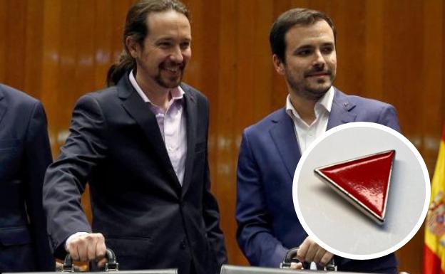 ¿Qué significa el triángulo rojo invertido que llevaban Pablo Iglesias y Alberto Garzón durante su toma de posesión?